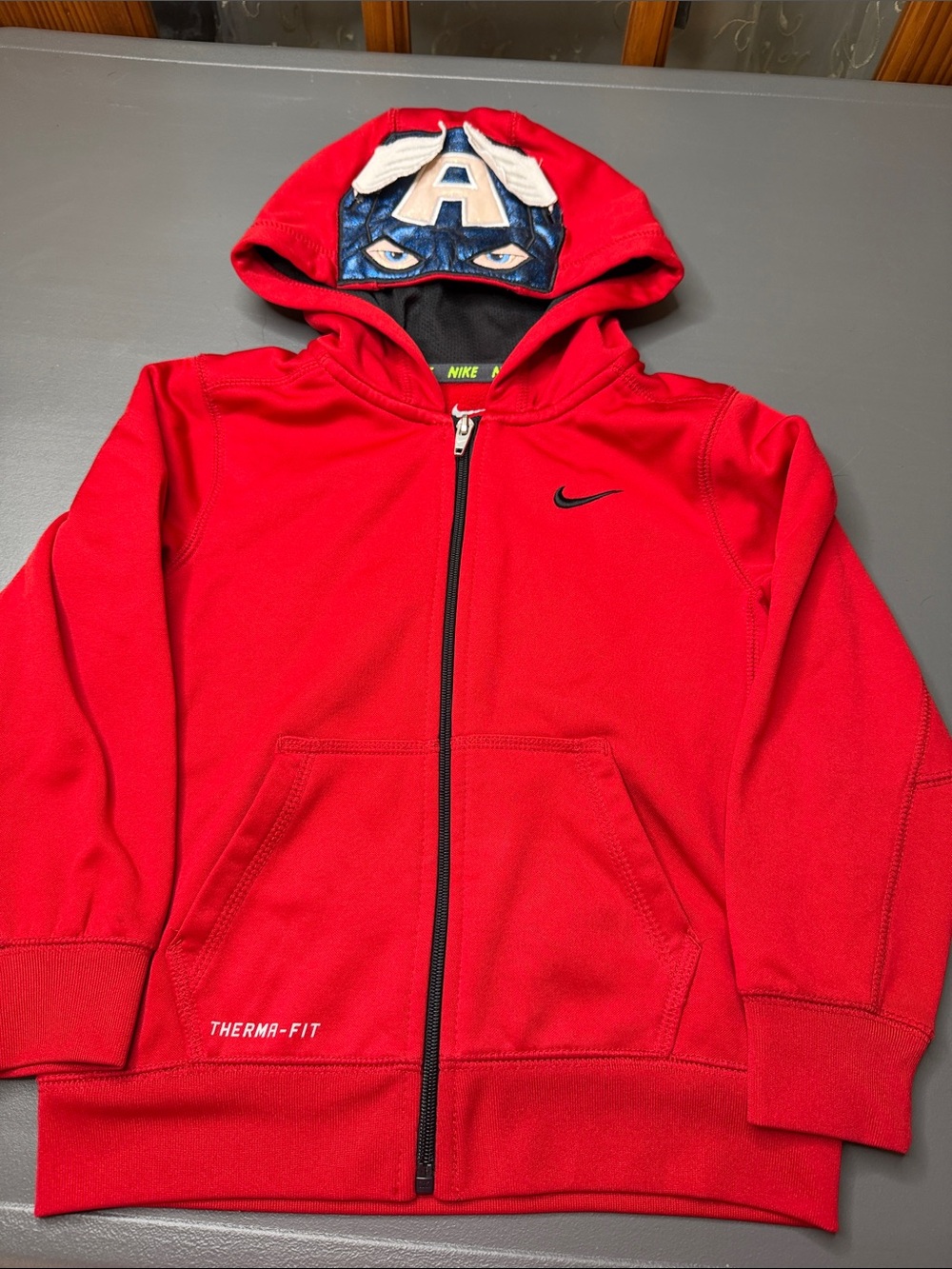 Kid’s custom Nike Red Therma-Fit Captain America Hooded Zip Sweatshirt. Size: 5
